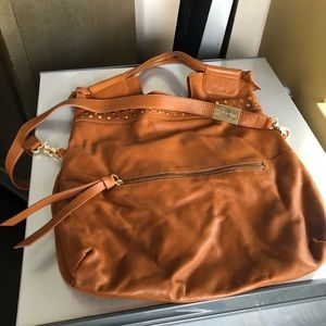 Soft leather bag with gold studs